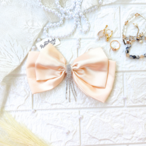 Cream 2 layer hair bow with hanging stone chain